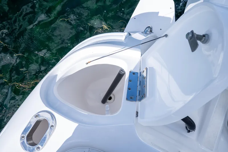  Yacht Photos Pics Open storage compartment on 2016 Intrepid 400 Cuddy boat, near clear water.