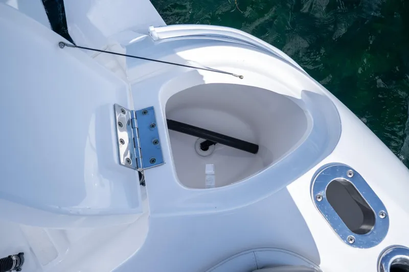  Yacht Photos Pics 2016 Intrepid 400 Cuddy boat detail showing storage compartment and hinge.