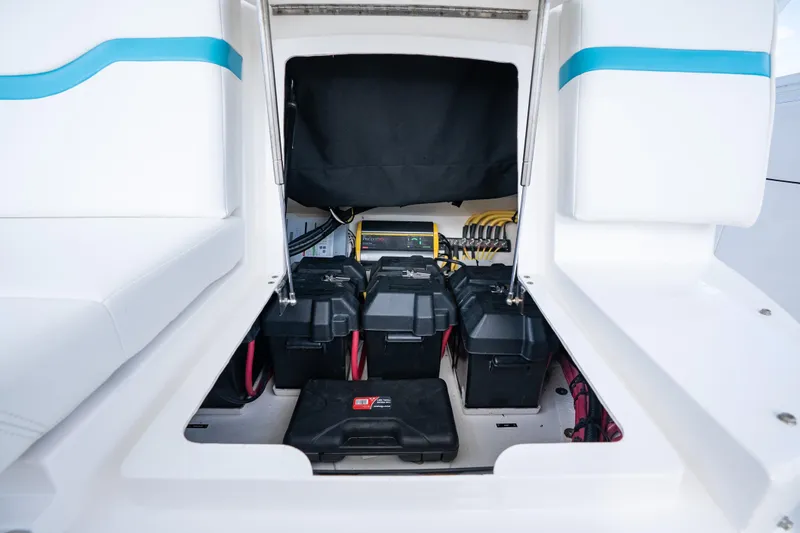  Yacht Photos Pics 2016 Intrepid 400 Cuddy boat battery compartment with organized wiring and storage.