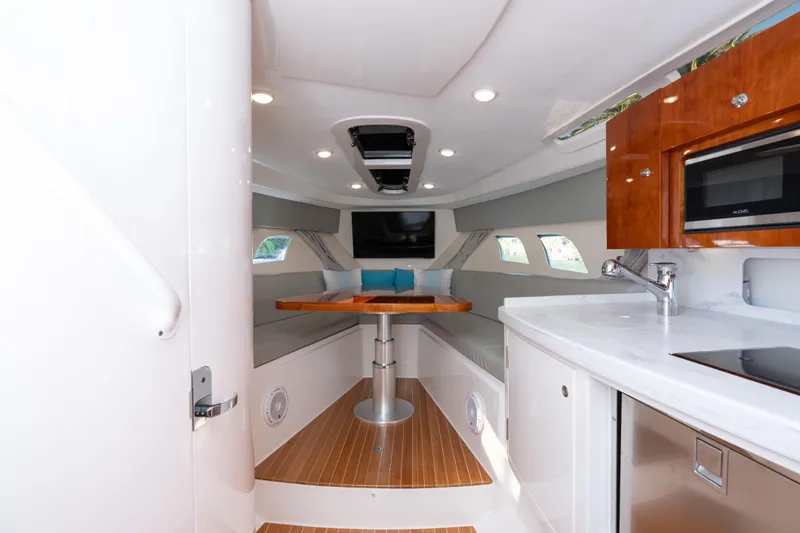  Yacht Photos Pics Luxurious interior of 2016 Intrepid 400 Cuddy boat with modern amenities and seating.