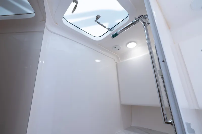  Yacht Photos Pics Interior of 2016 Intrepid 400 Cuddy boat, featuring a modern shower area.