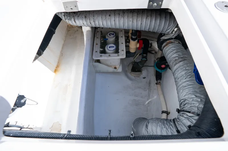  Yacht Photos Pics 2016 Intrepid 400 Cuddy engine compartment with hoses and mechanical components.