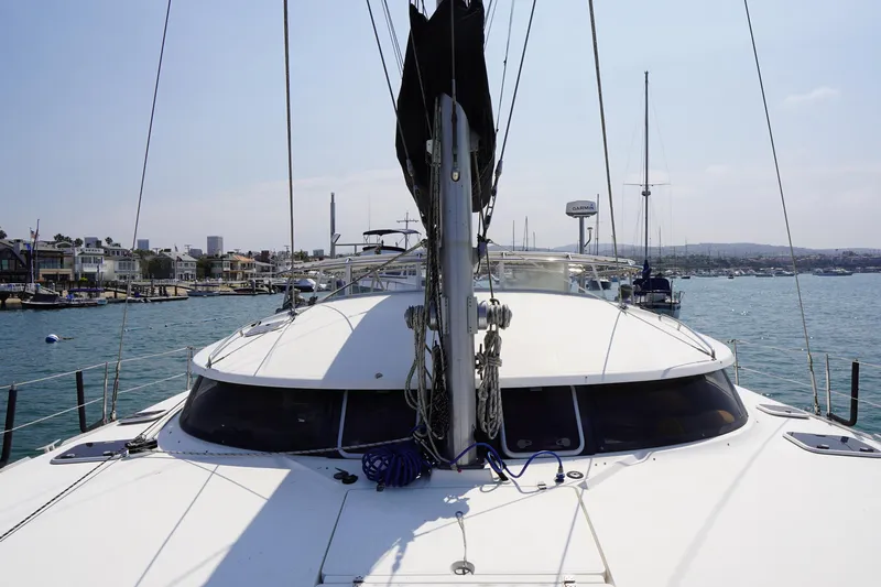 Loki Yacht Photos Pics 1995 Fountaine Pajot Venezia 42 catamaran docked in a marina with coastal view.