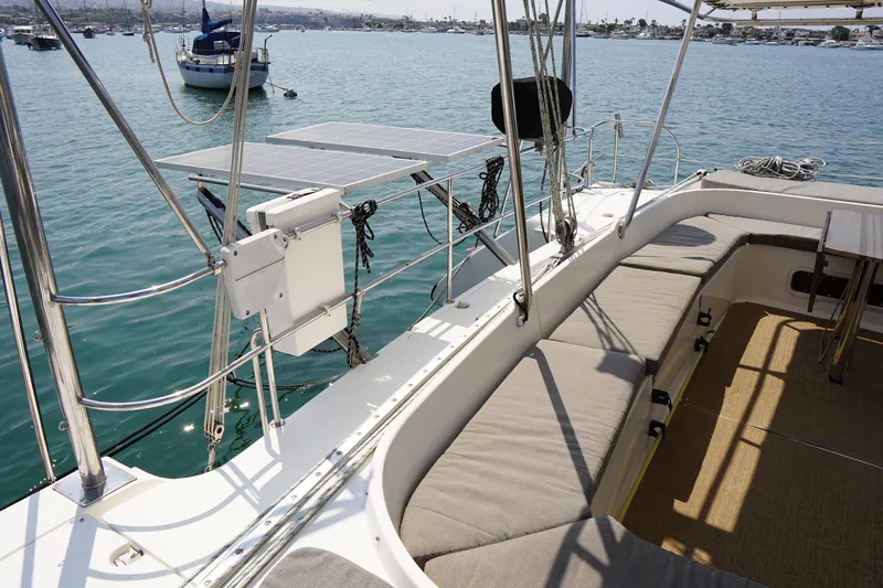 Loki Yacht Photos Pics Spacious deck of 1995 Fountaine Pajot Venezia 42 catamaran with seating and solar panels.