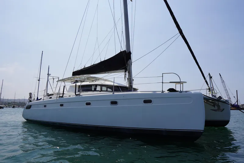 Loki Yacht Photos Pics 1995 Fountaine Pajot Venezia 42 catamaran sailing on calm waters.