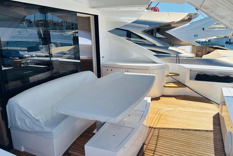  Yacht Photos Pics Luxurious 2009 Pershing 80' yacht deck with seating and sleek design.