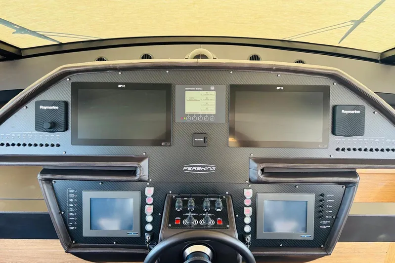  Yacht Photos Pics Cockpit of 2009 Pershing 80' yacht with advanced navigation systems and controls.