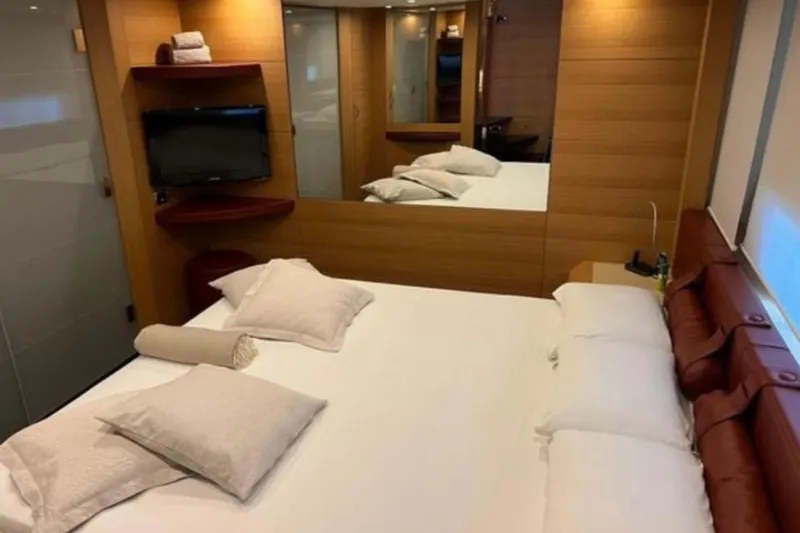  Yacht Photos Pics Luxurious bedroom interior on 2009 Pershing 80' yacht with modern amenities and elegant design.