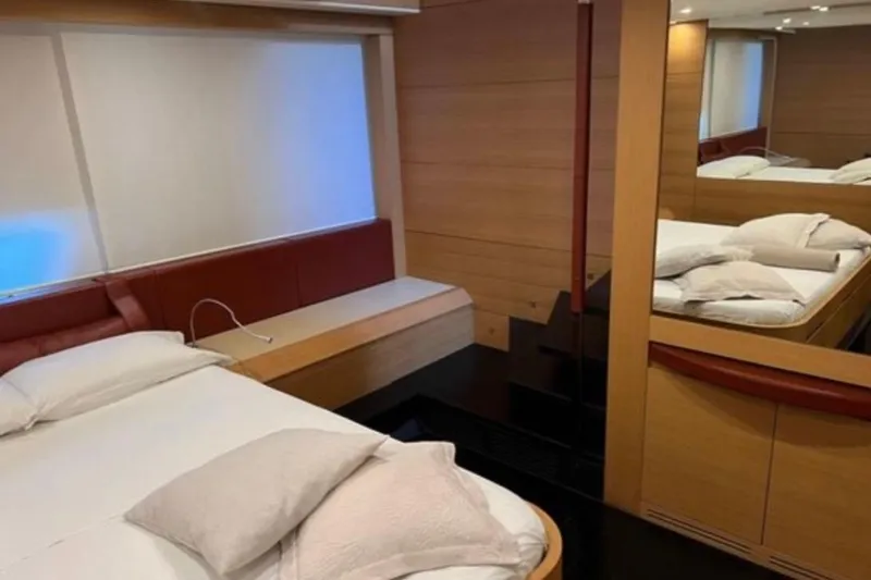  Yacht Photos Pics Luxurious bedroom interior of 2009 Pershing 80' yacht with modern design and cozy bedding.