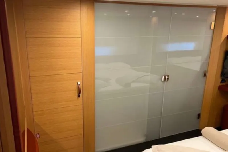  Yacht Photos Pics Interior of 2009 Pershing 80' yacht with modern wood and glass sliding doors.