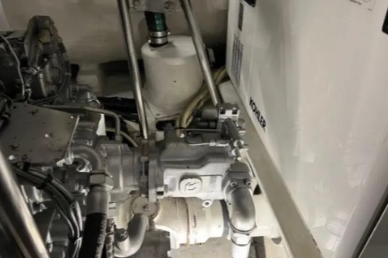  Yacht Photos Pics Engine room of 2009 Pershing 80' yacht, showcasing mechanical components and piping.