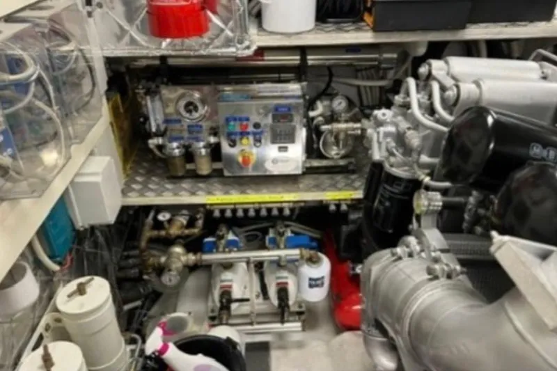  Yacht Photos Pics Engine room of a 2009 Pershing 80' yacht with complex machinery and equipment.