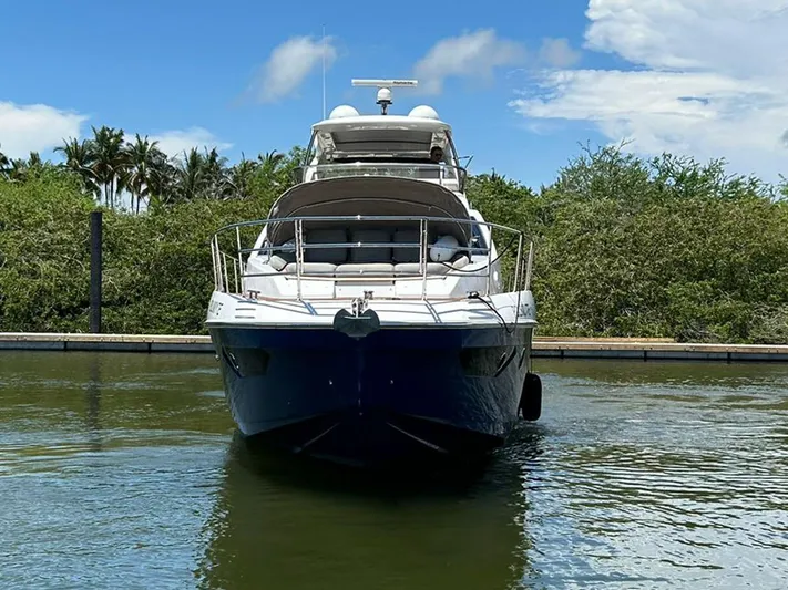 2021 Azimut 55 Fly @vallarta  Yacht Photos Pics Azimut 55 yacht, 2021 model, docked in a serene marina setting.