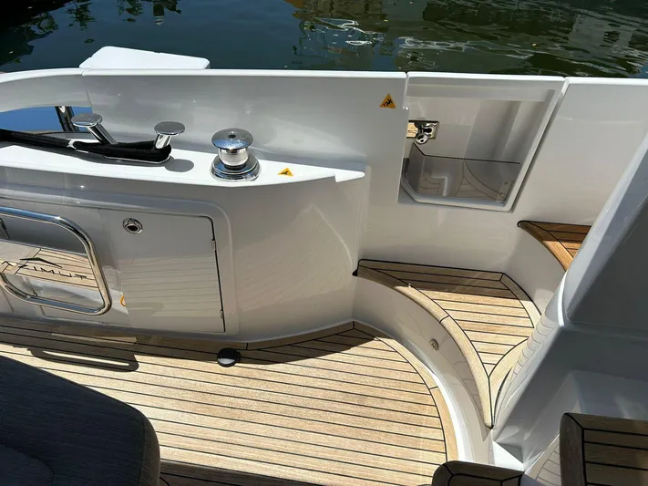 2021 Azimut 55 Fly @vallarta  Yacht Photos Pics Azimut 55 yacht deck, 2021 model, featuring sleek design and wooden flooring.