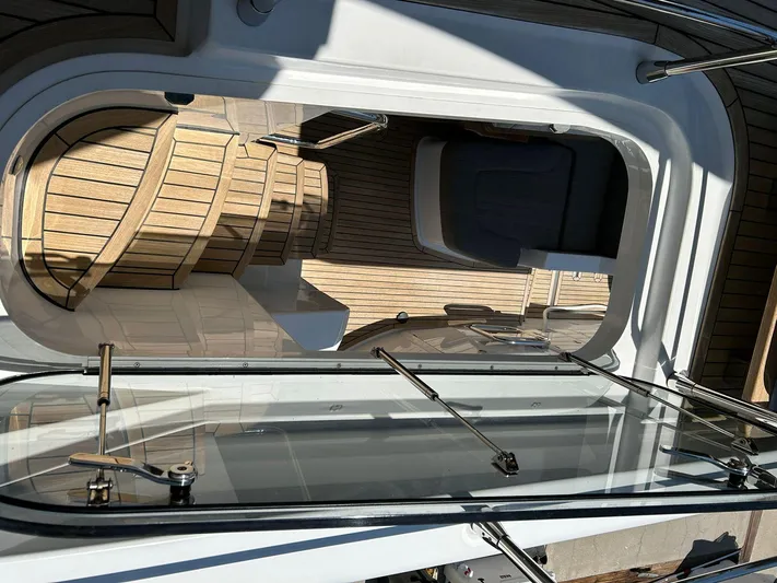 2021 Azimut 55 Fly @vallarta  Yacht Photos Pics Azimut 55 yacht interior, 2021 model, featuring sleek design and wooden flooring.