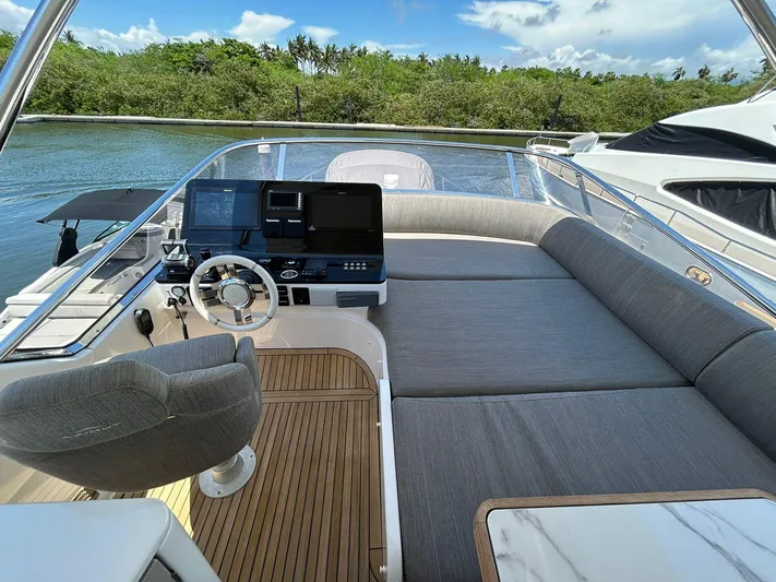 2021 Azimut 55 Fly @vallarta  Yacht Photos Pics Luxurious 2021 Azimut 55 yacht cockpit with plush seating and modern controls.