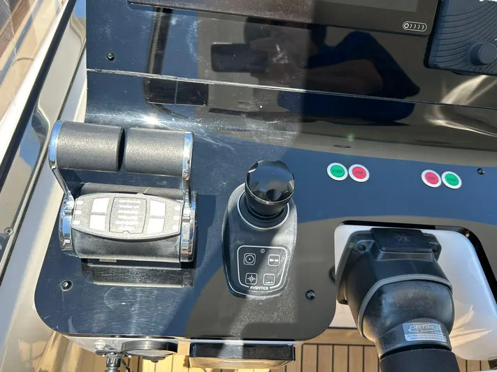 2021 Azimut 55 Fly @vallarta  Yacht Photos Pics Control panel of a 2021 Azimut 55 yacht with throttle and joystick.