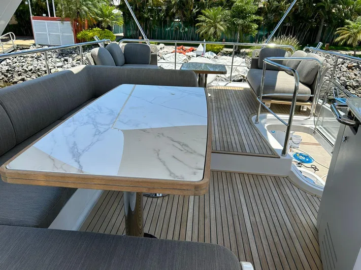 2021 Azimut 55 Fly @vallarta  Yacht Photos Pics Luxurious Azimut 55 yacht deck with elegant seating and marble table, 2021 model.