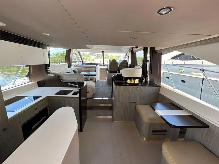 2021 Azimut 55 Fly @vallarta  Yacht Photos Pics Luxurious interior of a 2021 Azimut 55 yacht with modern furnishings and spacious layout.