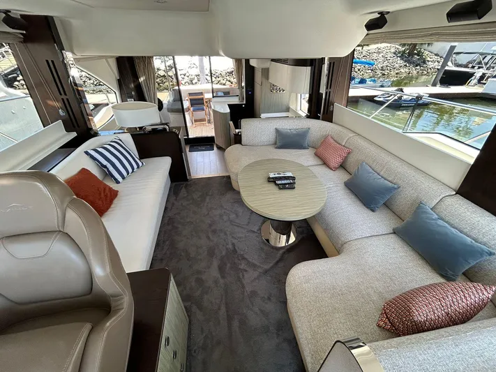 2021 Azimut 55 Fly @vallarta  Yacht Photos Pics Luxurious interior of 2021 Azimut 55 yacht with plush seating and elegant decor.