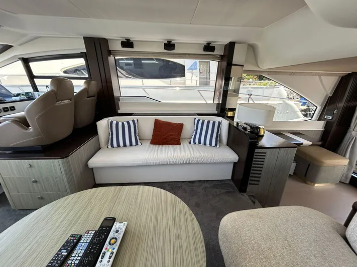 2021 Azimut 55 Fly @vallarta  Yacht Photos Pics Luxurious interior of a 2021 Azimut 55 yacht with modern seating and decor.