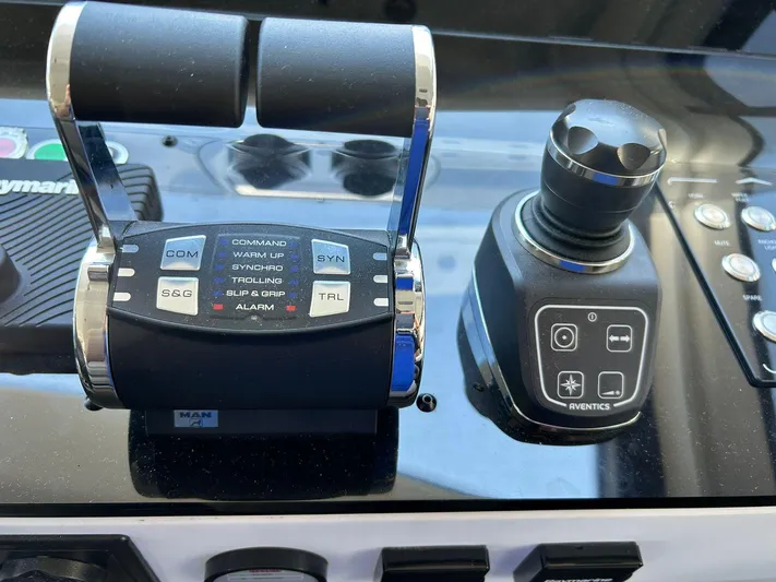 2021 Azimut 55 Fly @vallarta  Yacht Photos Pics Control panel of a 2021 Azimut 55 yacht with throttle and joystick.