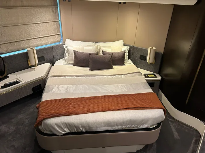 2021 Azimut 55 Fly @vallarta  Yacht Photos Pics Luxurious bedroom interior of 2021 Azimut 55 yacht with modern design and cozy bedding.