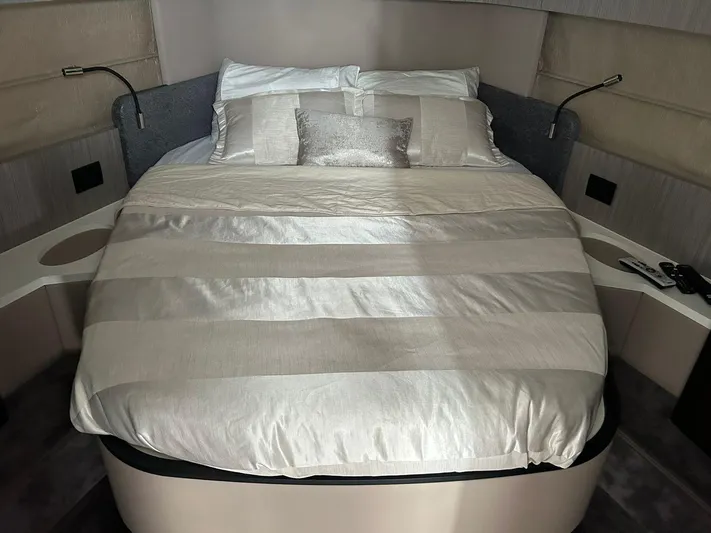 2021 Azimut 55 Fly @vallarta  Yacht Photos Pics Luxurious bedroom interior of 2021 Azimut 55 yacht with elegant bedding.