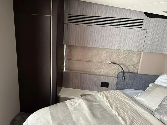 2021 Azimut 55 Fly @vallarta  Yacht Photos Pics Luxurious interior of a 2021 Azimut 55 yacht bedroom with modern design elements.