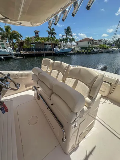  Yacht Photos Pics 2010 Grady-White Canyon 336 boat interior with plush seating and waterfront view.