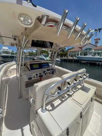  Yacht Photos Pics 2010 Grady-White Canyon 336 boat interior with helm, rod holders, and navigation equipment.