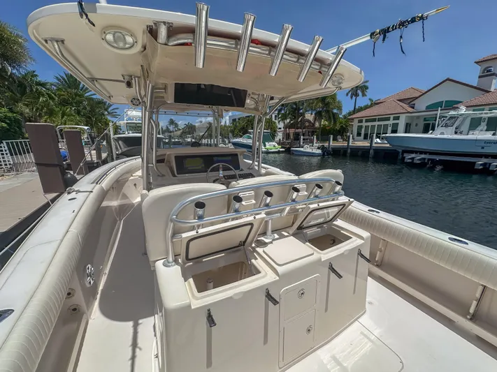  Yacht Photos Pics 2010 Grady-White Canyon 336 boat docked, featuring spacious deck and fishing rod holders.