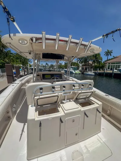  Yacht Photos Pics 2010 Grady-White Canyon 336 boat docked, featuring spacious deck and fishing rod holders.