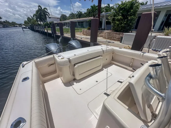  Yacht Photos Pics 2010 Grady-White Canyon 336 boat docked, featuring spacious deck and dual outboard motors.