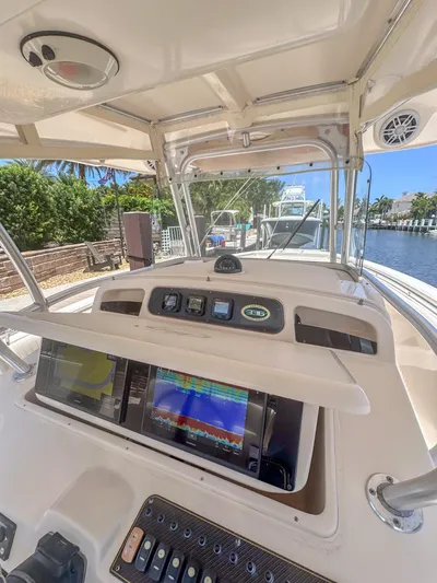  Yacht Photos Pics 2010 Grady-White Canyon 336 boat dashboard with navigation screens and controls.