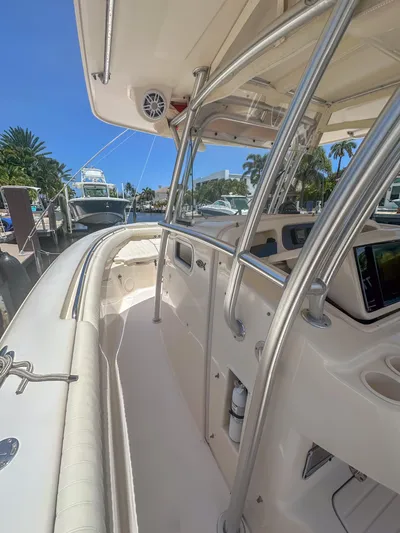  Yacht Photos Pics 2010 Grady-White Canyon 336 boat interior with stainless steel railings and navigation equipment.