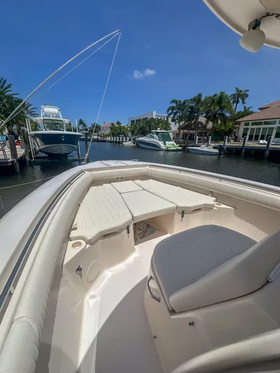  Yacht Photos Pics 2010 Grady-White Canyon 336 boat docked in sunny marina, featuring spacious seating.