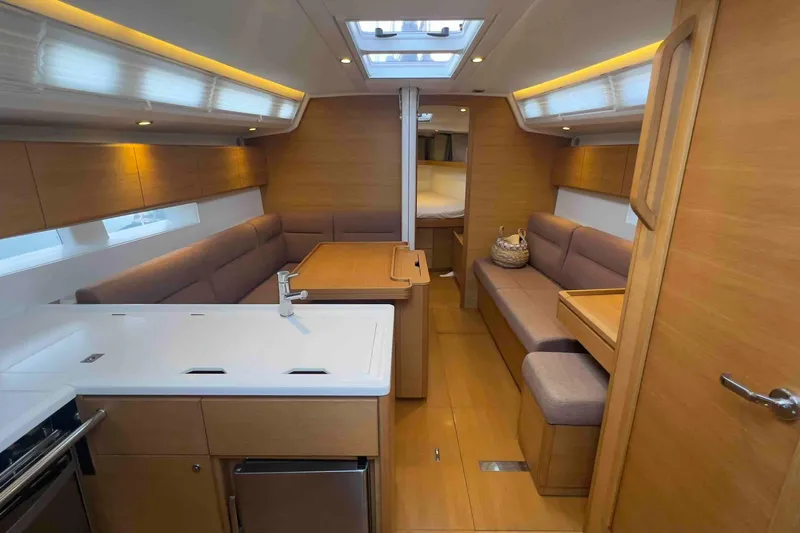  Yacht Photos Pics Luxurious interior of 2015 Grand Soleil 39 Maletto yacht with modern wood finish.