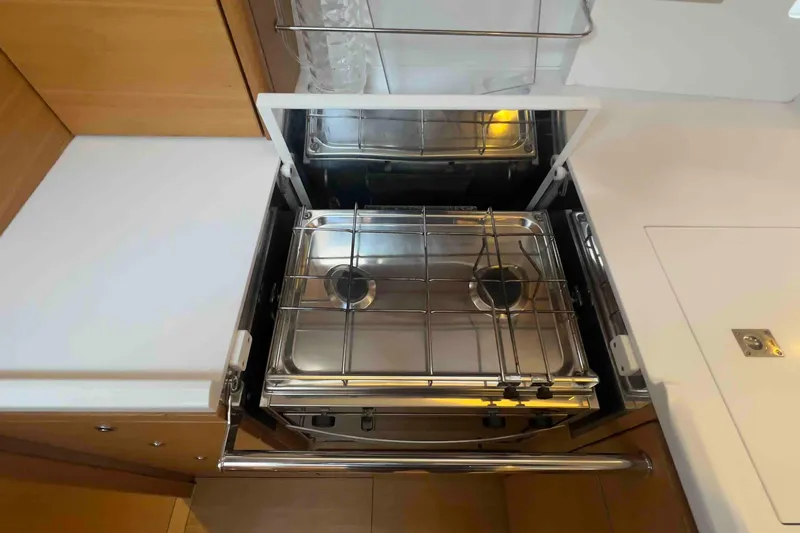  Yacht Photos Pics Stove in 2015 Grand Soleil 39 Maletto yacht kitchen, featuring a sleek, compact design.