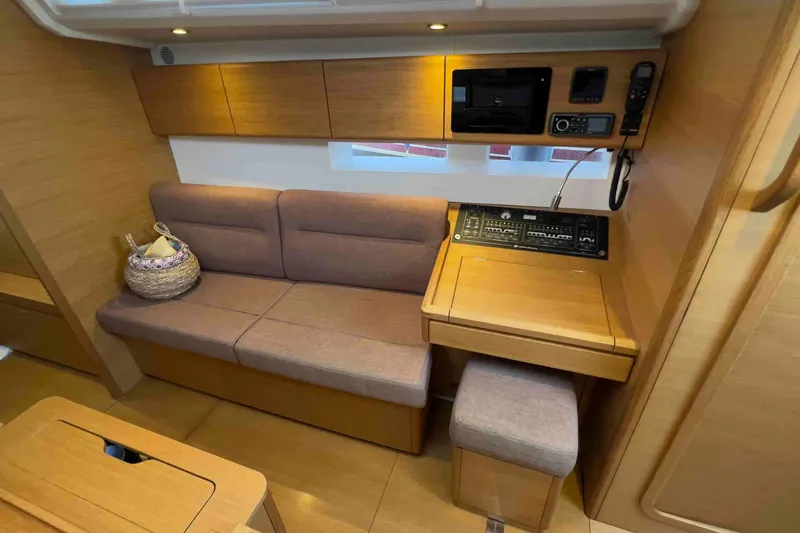  Yacht Photos Pics Interior of 2015 Grand Soleil 39 Maletto yacht with cozy seating and navigation station.