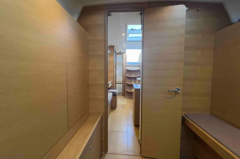  Yacht Photos Pics Interior of 2015 Grand Soleil 39 Maletto yacht, featuring wooden paneling and modern design.