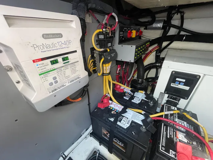 Pura Vida Yacht Photos Pics Engine compartment of 2016 Monterey 335 Sport Yacht with ProNautic charger and batteries.