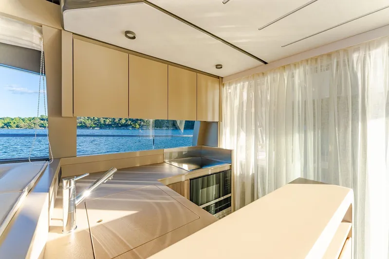 M/y La Seduction Yacht Photos Pics Luxurious kitchen interior of 2022 Ferretti Yachts 550 with scenic water view.