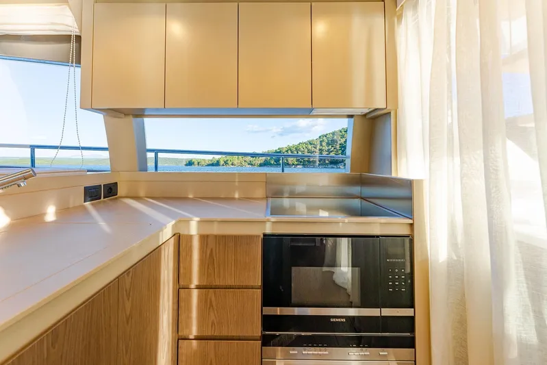 M/y La Seduction Yacht Photos Pics Modern kitchen interior on 2022 Ferretti Yachts 550 with ocean view.