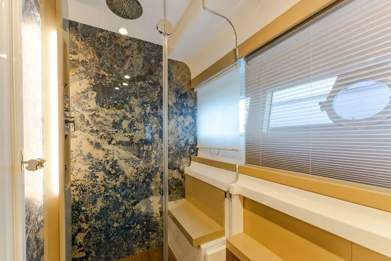M/y La Seduction Yacht Photos Pics Luxurious bathroom interior of 2022 Ferretti Yachts 550 with elegant marble and modern fixtures.