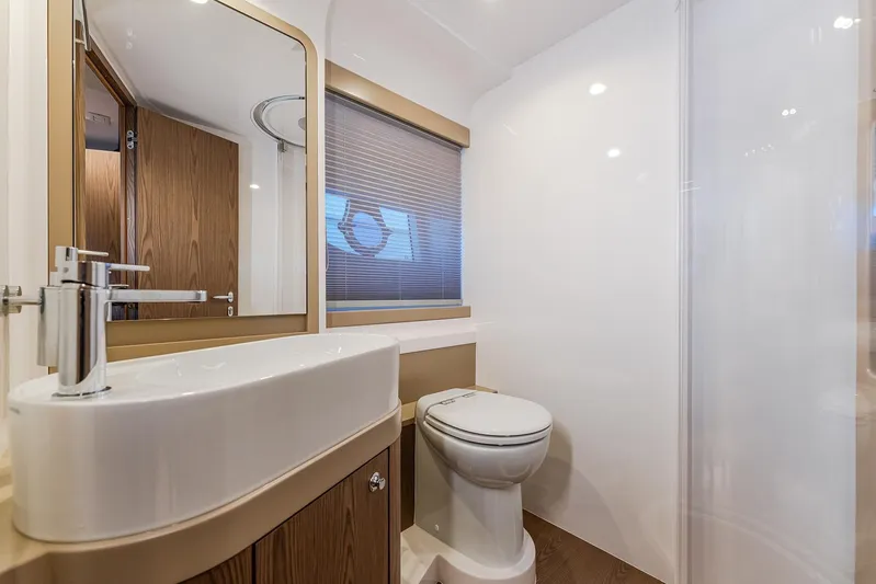 M/y La Seduction Yacht Photos Pics Luxurious bathroom in 2022 Ferretti Yachts 550, featuring modern sink and toilet.