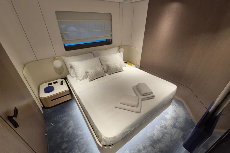  Yacht Photos Pics Luxurious bedroom interior of 2025 Azimut Grande 26M yacht with modern design.