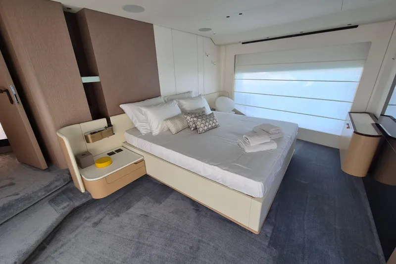  Yacht Photos Pics Luxurious bedroom interior of 2025 Azimut Grande 26M yacht, featuring modern design and elegant furnishings.