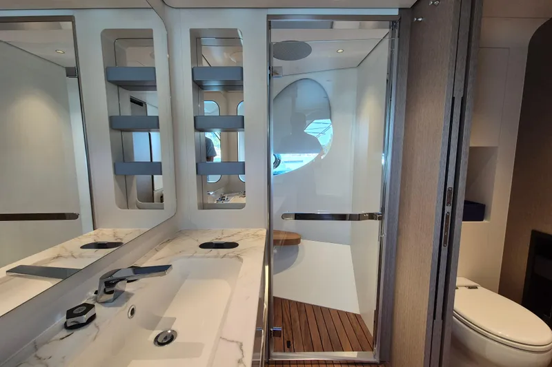  Yacht Photos Pics Luxurious bathroom interior of 2025 Azimut Grande 26M yacht with modern fixtures.