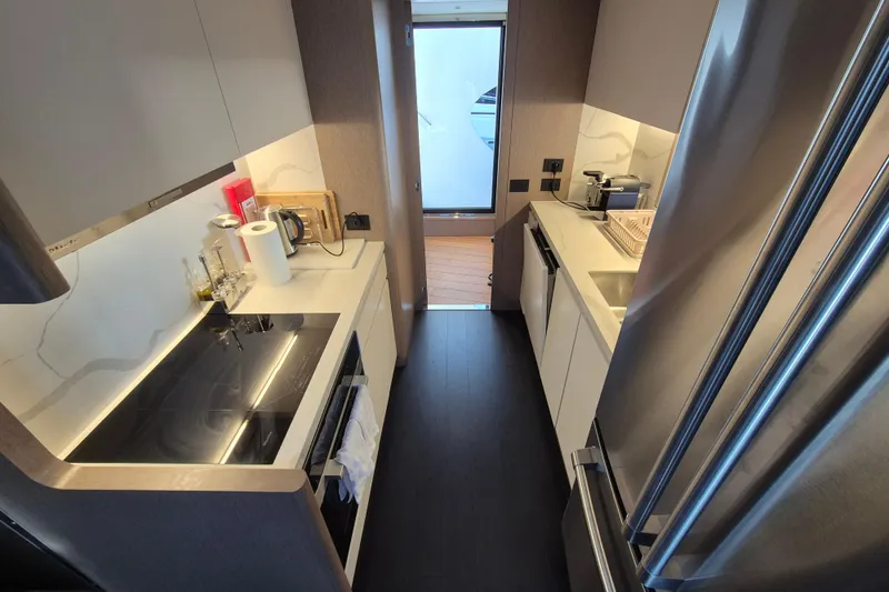  Yacht Photos Pics Modern kitchen interior of 2025 Azimut Grande 26M yacht with sleek appliances.